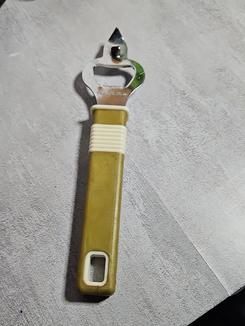 vintage dual-purpose manual opener, commonly known as a church key.